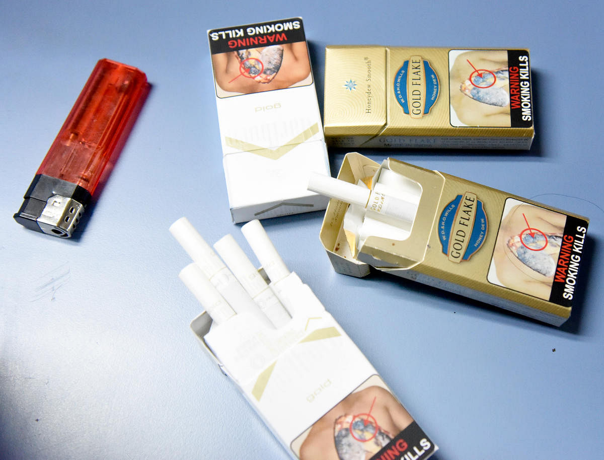 Go with DH story...Cigarette packs, Photo/ B H Shivakumarjjhjh