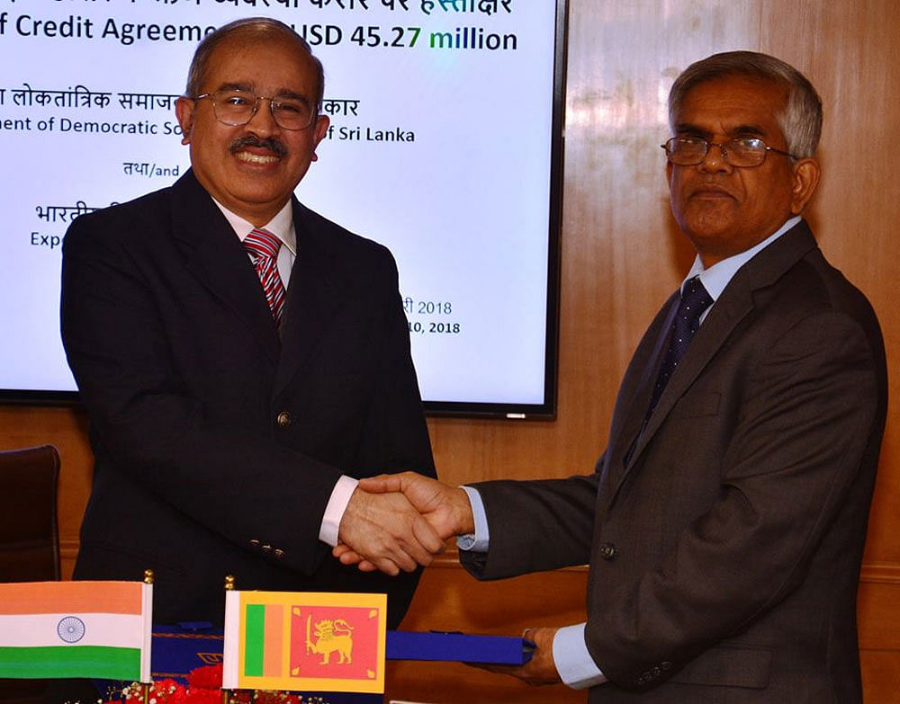 David Rasquinha and RHS Samaratunga after signing the agreement which will see India fund the KKS Harbour upgrade. Twitter photo.