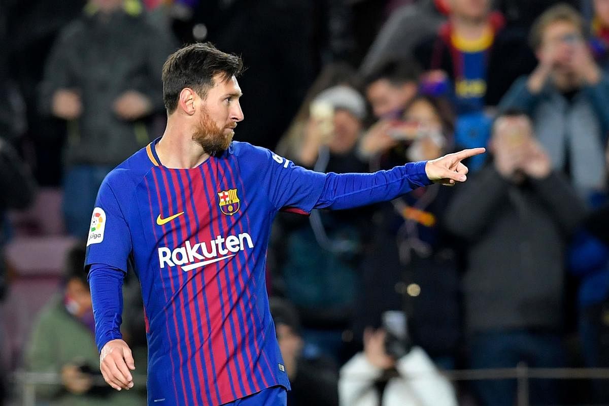 Barcelona's Argentinian forward Lionel Messi celebrates after scoring his second goal during the Spanish Copa del Rey (King's Cup) round of 16 second leg football match FC Barcelona vs RC Celta de Vigo at the Camp Nou stadium in Barcelona on January 11, 2018. / AFP PHOTO / LLUIS GENE