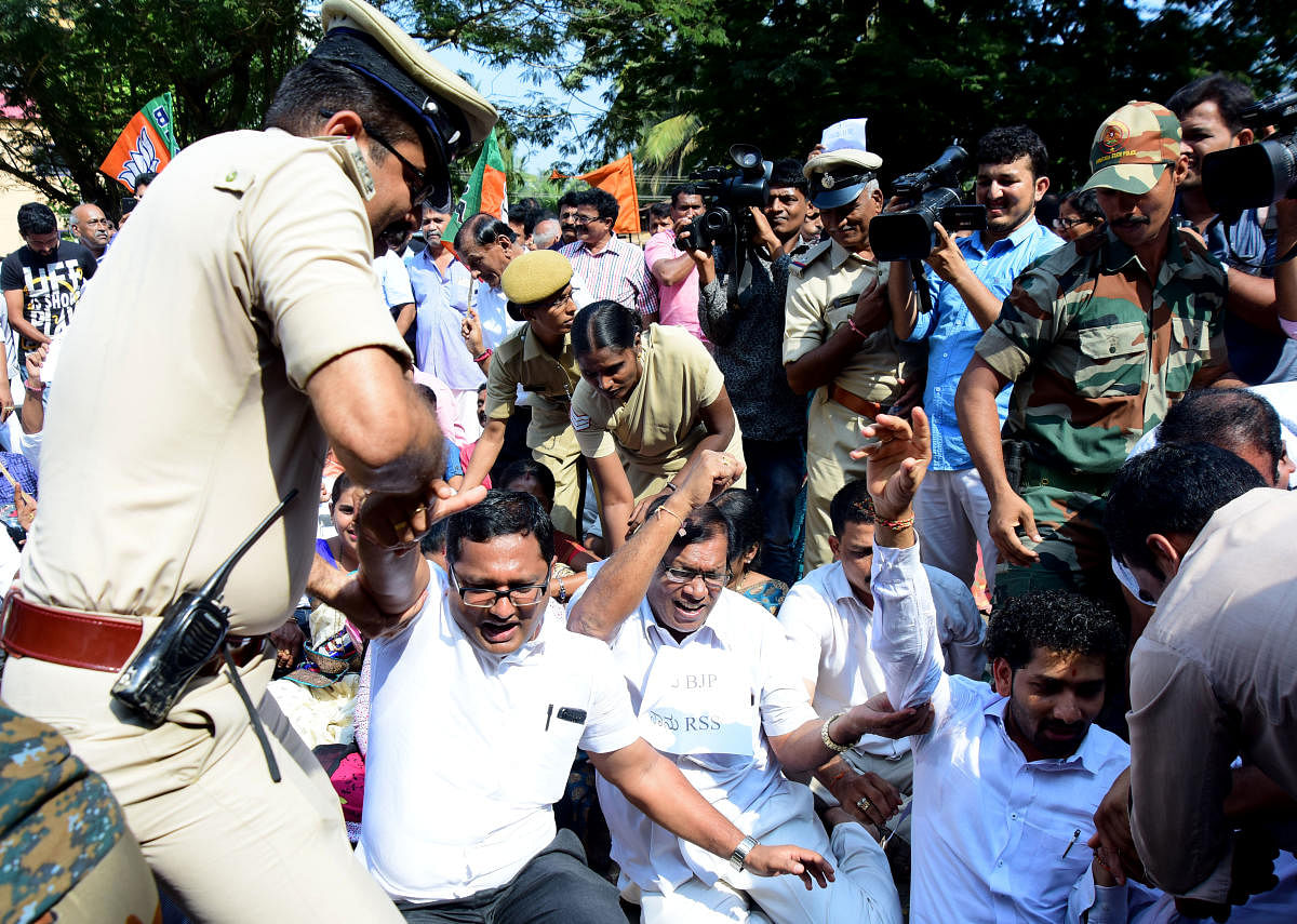 Police arrest BJP leaders who staged a protest in front of Congress Bhavana in Mallikatte on Friday.