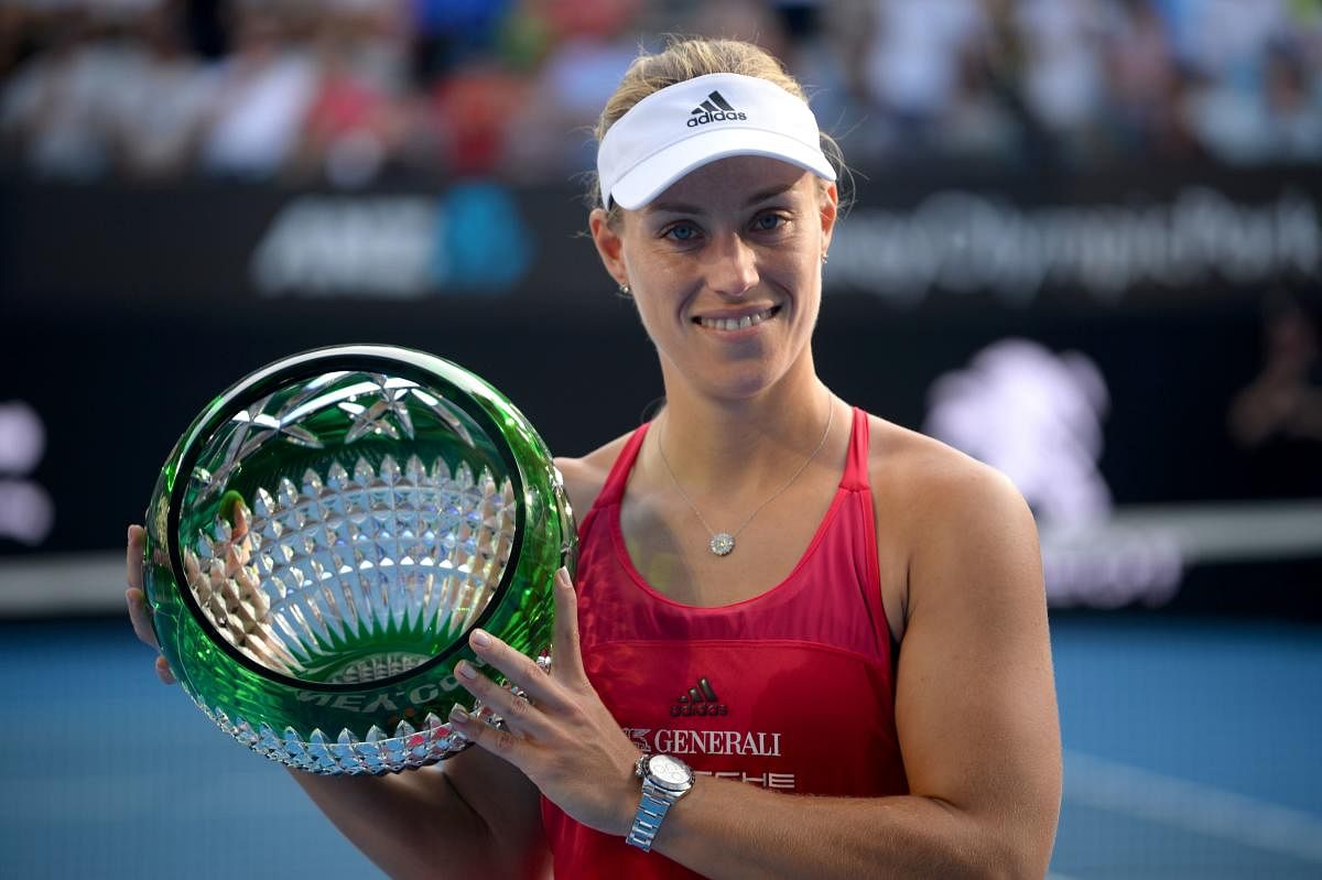 Angelique Kerber of Germany with the trophy after beating Ashley Barty of Australia in the women's singles final of the Sydney International tennis tournament. AFP