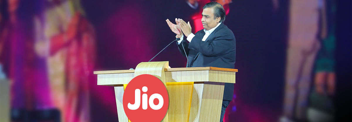 Mukesh Ambani claps while inaugurating Jio mobiles in Mumbai.