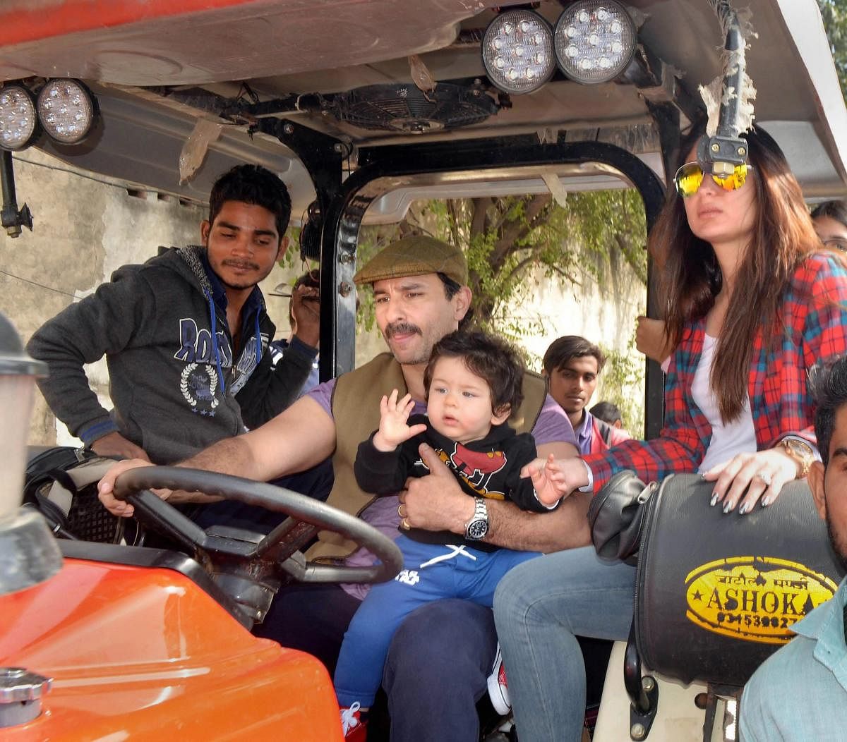 Bollywood actor Saif Ali Khan, Kareena Kapoor Khan and their son Taimur Ali Khan ride a tractor at Pataudi Palace in Gurugram.