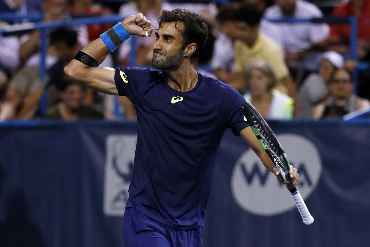 Aug 2, 2017; Washington, DC, USA; Yuki Bhambri of India celebrates after match point against Gael Monfils of France (not pictured) on day three of the Citi Open at Fitzgerald Tennis Center. Bhambri won 6-3, 4-6, 7-5. Mandatory Credit: Geoff Burke-USA TODAY Sports