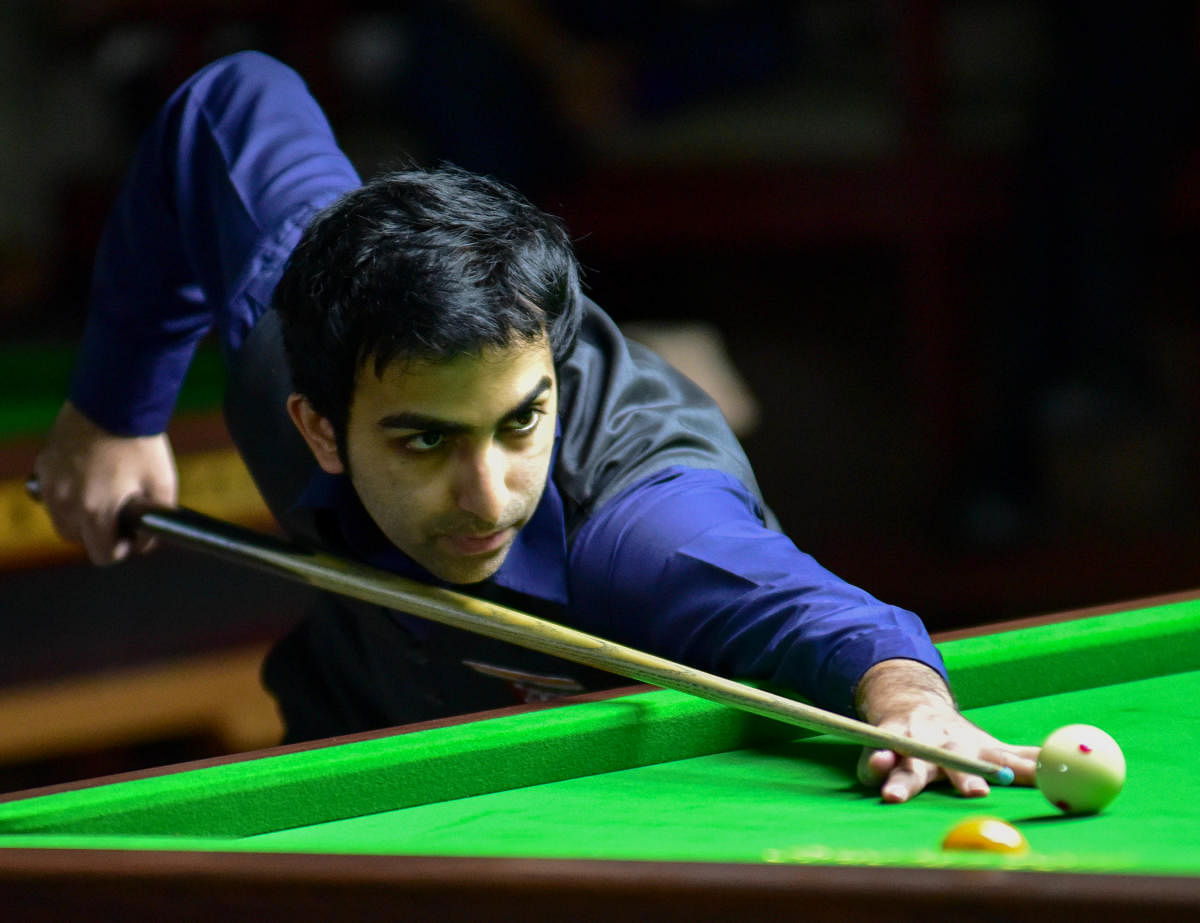 ON SONG Pankaj Advani of PSPB en route to his win over Rupesh Shah in the semifinal at the KSBA on Sunday. DH PHOTO/BH SHIVAKUMAR