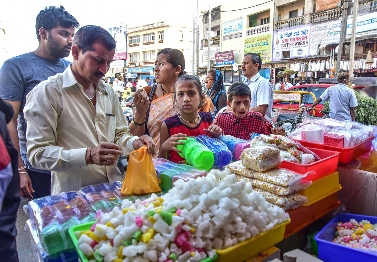People are busy in shopping ahead of Sankranthi Festival, at Chikka Gadiyara in Mysuru on Sunday January 14, 2018- PHOTO / IRSHAD MAHAMMAD