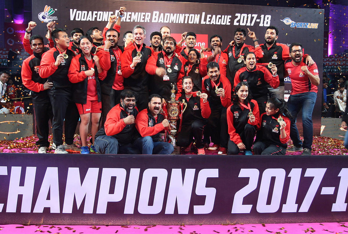 TRIUMPHANT Hyderabad Hunters celebrate after winning the third edition of the Premier Badminton League.