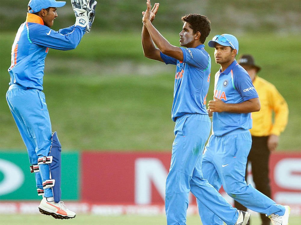 Three-time champions India stormed into the ICC U-19 World Cup quarterfinals after inflicting a humiliating 10-wicket loss on minnows Papua New Guinea in a low-scoring group B clash here today. DH File Photo