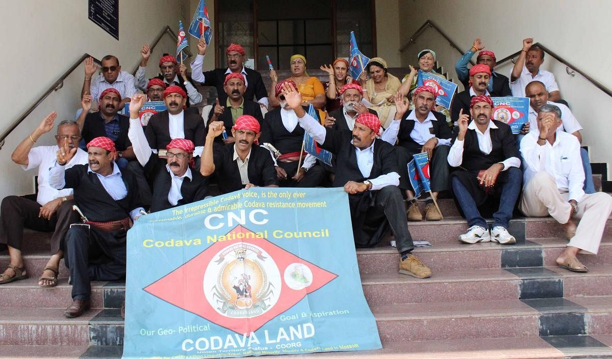 Codava National Council members stage a protest in Madikeri on Tuesday to urge the government to conduct a genealogical study of Kodavas.