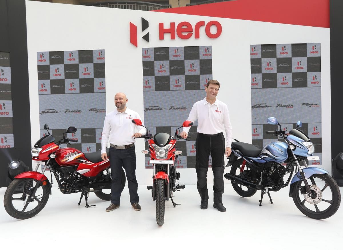Markus Braunsperger (right) and Malo Le Masson unveil the Hero Super Splendor, Passion PRO and Passion XPRO in New Delhi recently