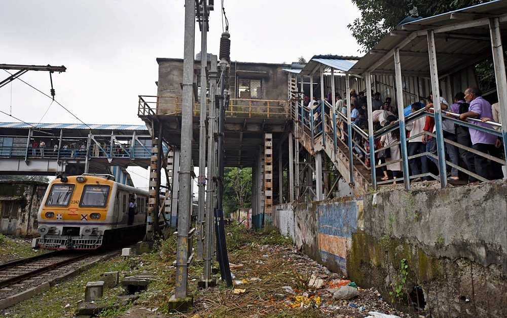 A stampede on a narrow foot over-bridge linking Parel and Elphinstone Road suburban train stations had left 23 dead and many more injured on September 29 last year. PTI File Photo