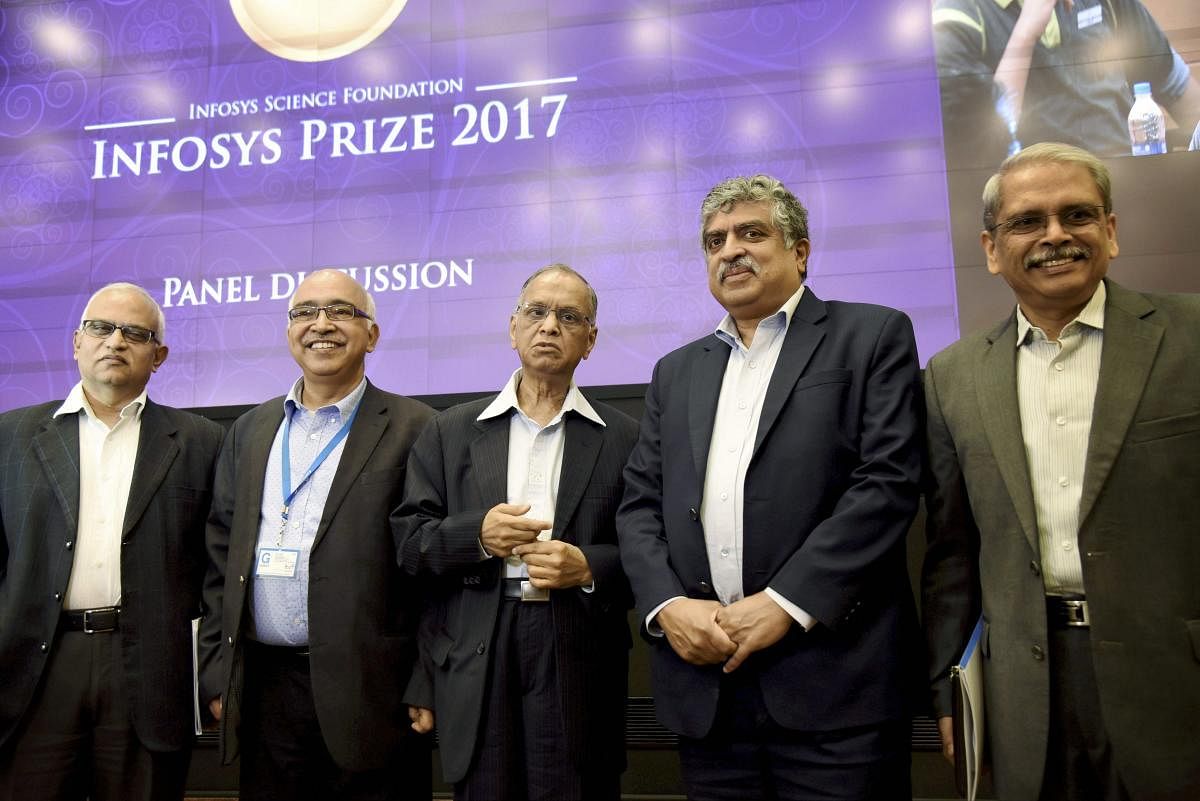 Infosys founders Narayan Murthy, Nandan Nilekani, Kris Gopalakrishna (R), K Dinesh and Srinath Batni (L) pose during the announcement of the winners of the Infosys Prize 2017 , and a panel discussion at Infosys headquarters in Bengaluru on Wednesday. PTI