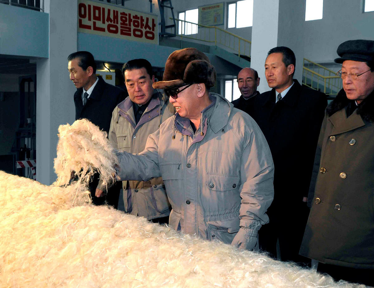North Korean leader Kim Jong-il (C) visits the Vinalon Complex in Hamheung, northeast of Pyongyang in this photo released by North Korea's KCNA news agency February 10, 2010. REUTERS