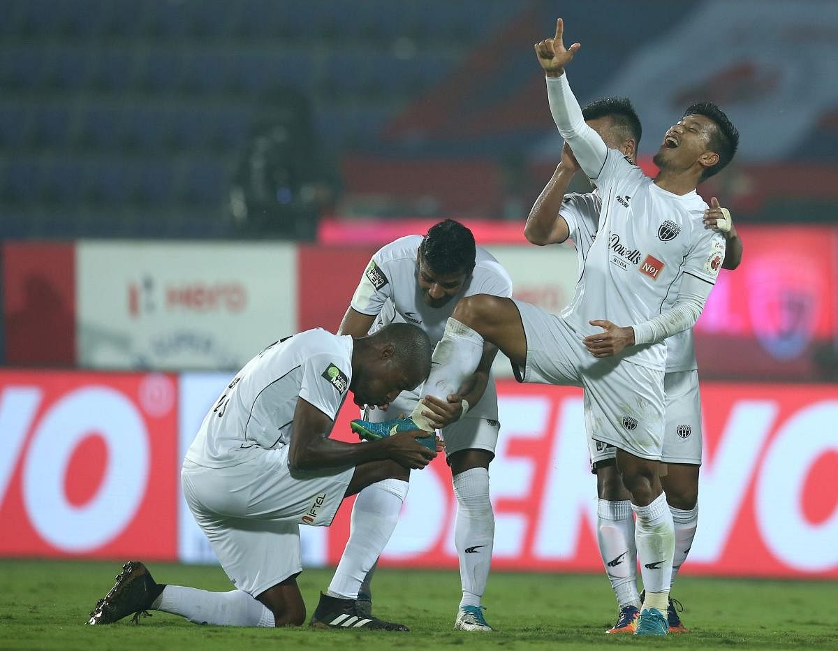 HERO OF THE DAY NorthEast United FC's Seiminlen Doungel (right) gets his boot kissed by a team-mate after scoring a hat-trick. ISL MEDIA