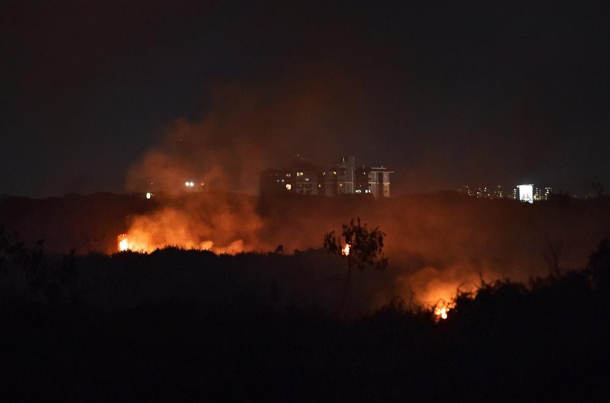 The fire that broke out at Bellandur lake on Friday. PTI