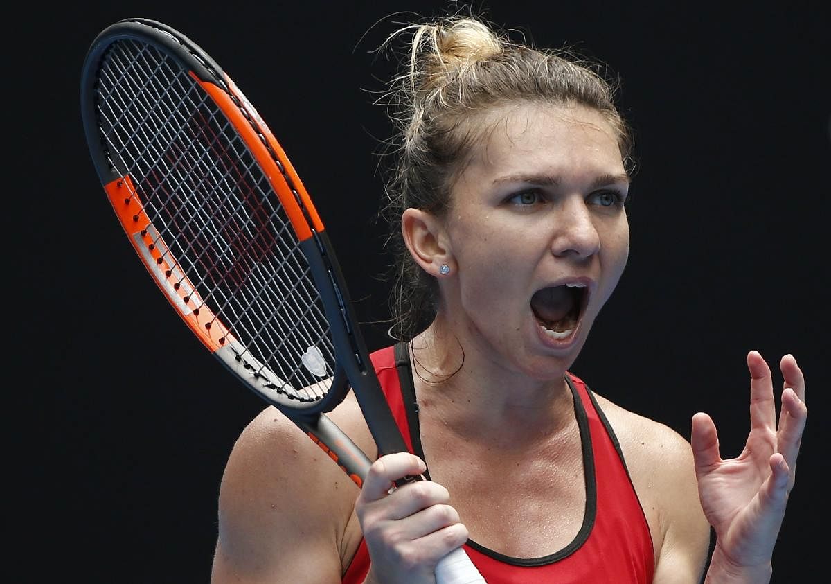 WAR CRY Simona Halep of Romania reacts after winning point against Lauren Davis of the US. REUTERS