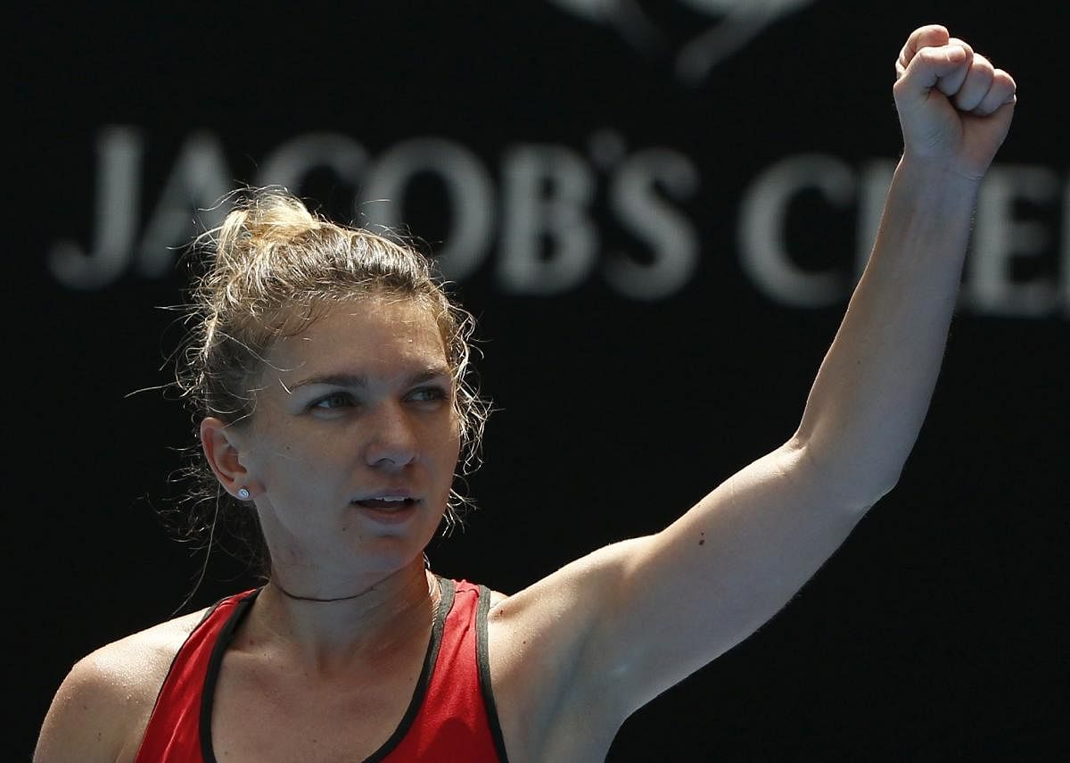 SIGH OF RELIEF: Romania's Simona Halep celebrates her third round win over Lauren Davis of US on Saturday. REUTERS