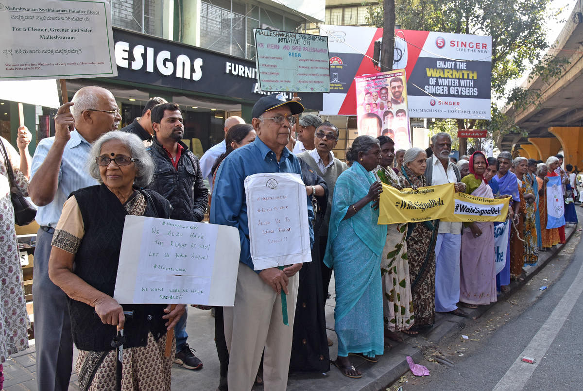 Senior citizens and various organisation members are participated in Nadeyalu bidi, 'Walk Signal Beku' for walkers organised by Citizens for Bengaluru at Richmond Circle in Bengaluru on Saturday. Photo by S K Dinesh