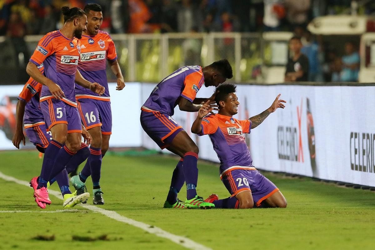 Pune City FC's Diego Carlos (right) celebrates with team-mates after scoring against ATK on Saturday. ISL MEDIA