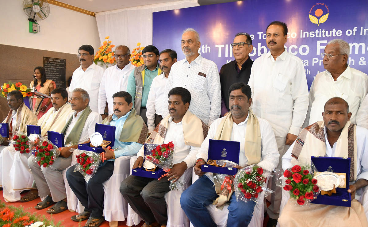 Tobacco growers being felicitated during the 18th Tobacco Farmers' Award ceremony organised by Tobacco Institute of India (TII), in a private hall, in Mysuru, on Saturday. Minister for Animal Husbandry A Manju, MP R Dhruvanarayan, Tobacco Board Secretary ASridhar Babu, are seen.