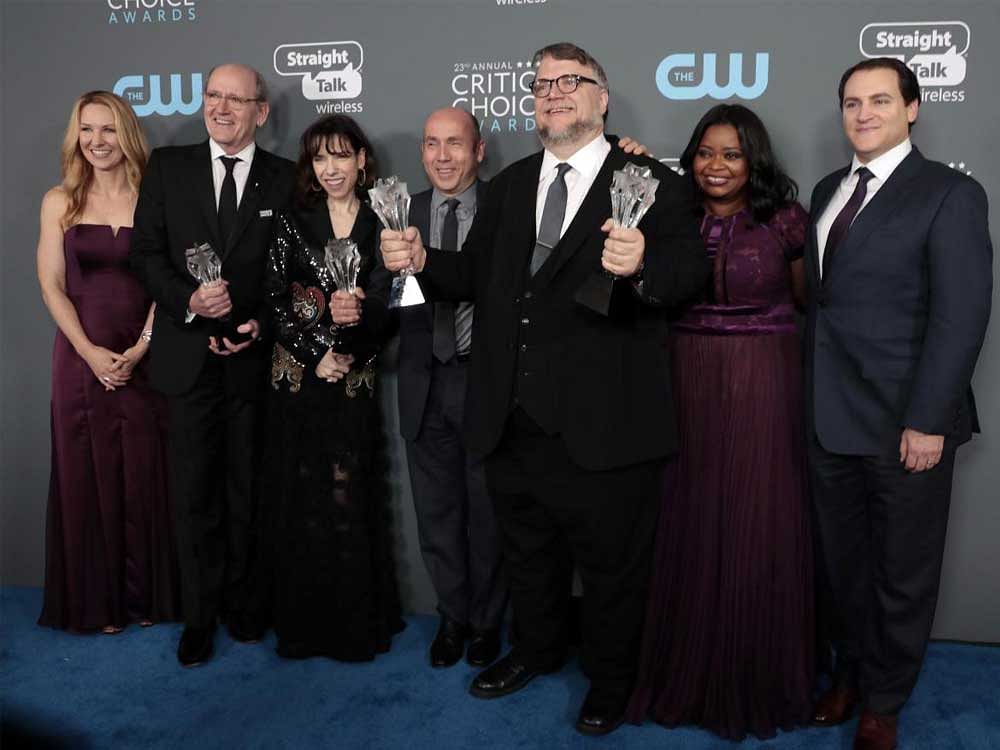 Guillermo del Toro and cast pose backstage with their Best Picture and Best Director awards for 'The Shape of Water'. Reuters Photo