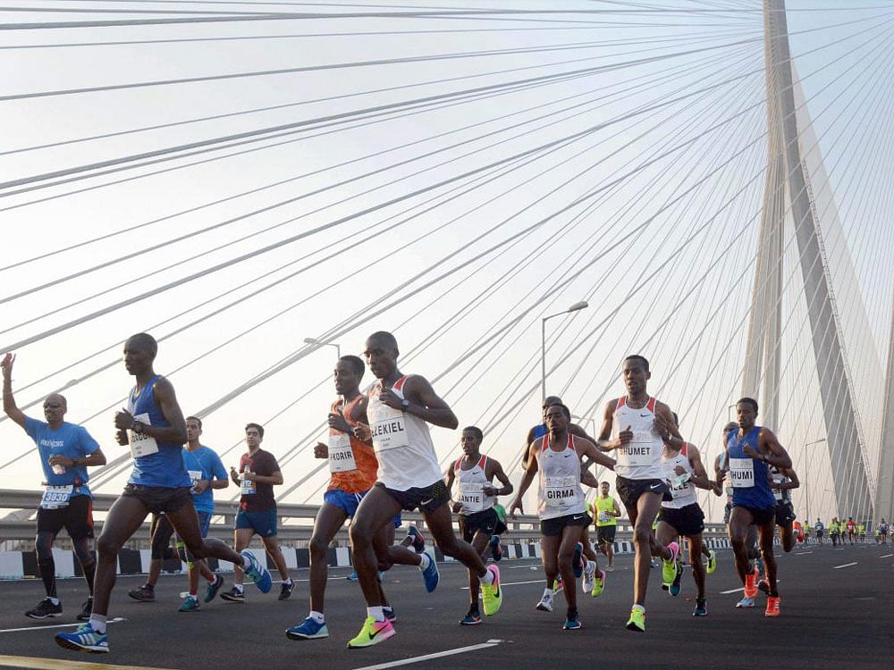 Participants at Tata Mumbai Marathon 2018 at Worli Sealink in Mumbai on Sunday. PTI.