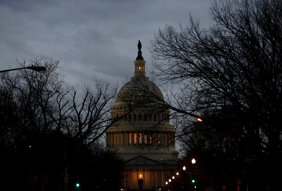The US Capitol is lit during the second day of a shutdown of the federal government in Washington, US, on Sunday. REUTERS