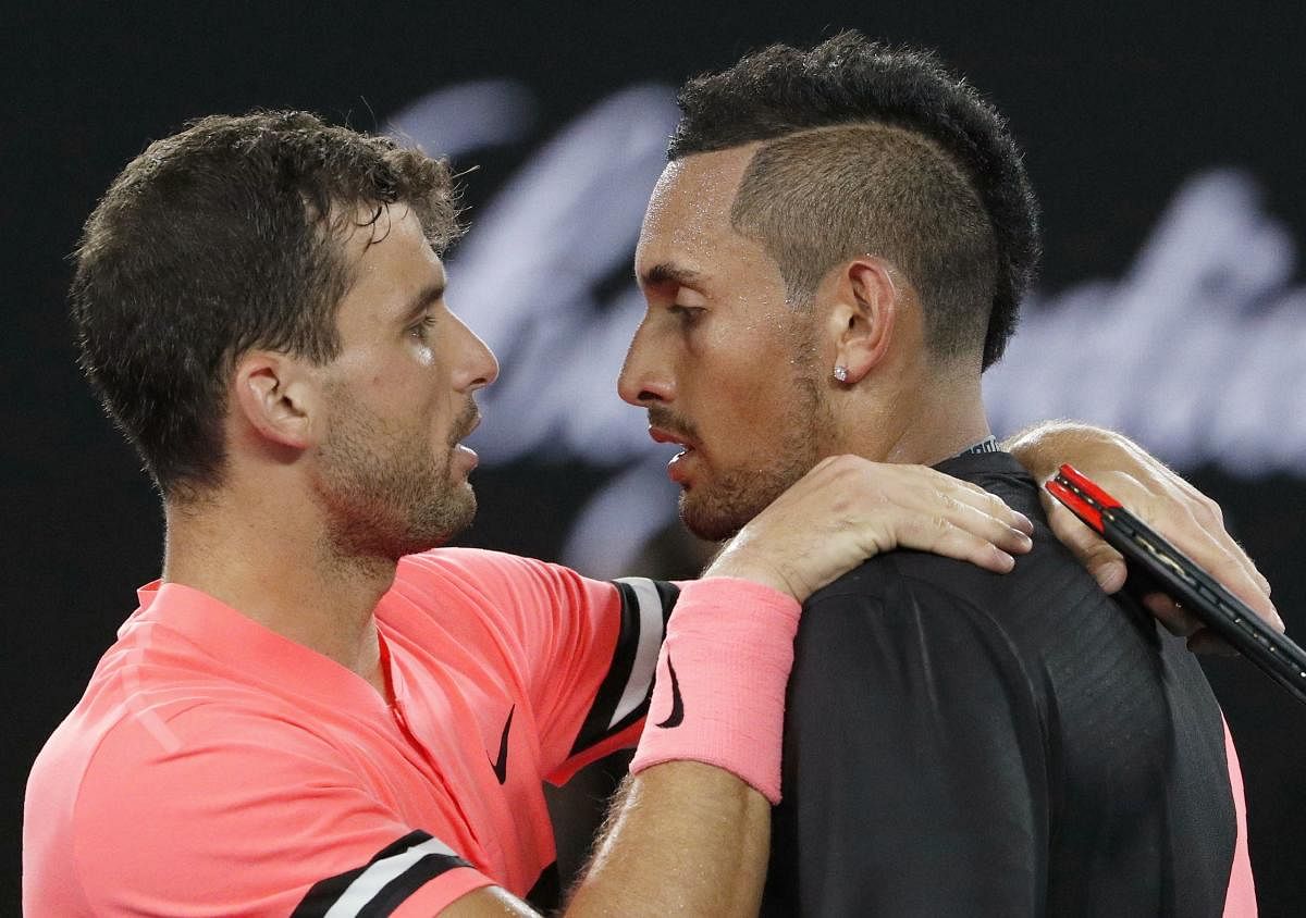 Grigor Dimitrov chats with Nick Kyrgios after defeating him in the Australian Open on Sunday. REUTERS