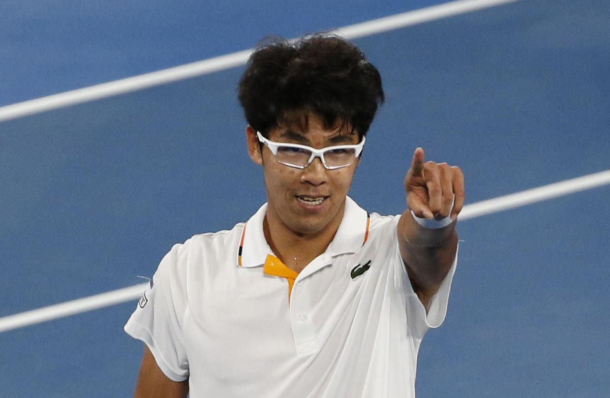 RISING HIGH: South Korea's Chung Hyeon celebrates after stunning Serbia's Novak Djokovic in the fourth round on Monday. REUTERS