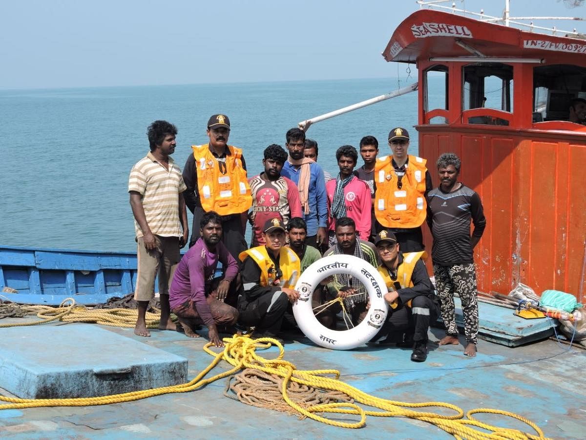 The Coast Guard staff with the 10 fishermen on IFB sea shell who were rescued off Malpe coast in Udupi district.