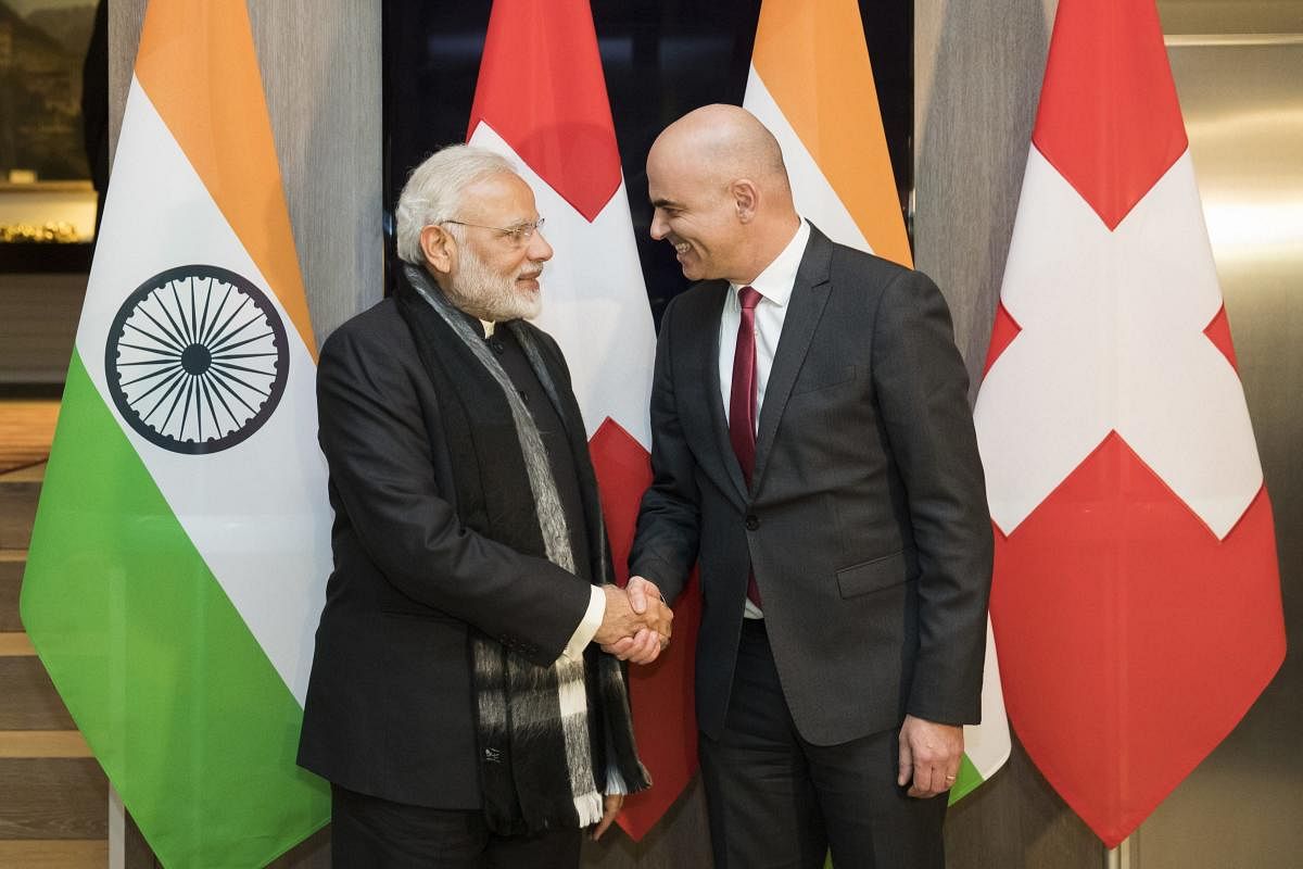 Swiss Federal President Alain Berset, right, and Indian Prime Minister Narendra Modi, shake hands prior to a meeting one day before the start of the 48th annual meeting of the World Economic Forum, WEF, in Davos, Switzerland. AP/PTI Photo