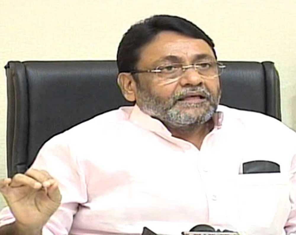 Nawab Malik of the NCP demanded that the Sena withdraw from the state government in Maharashtra.