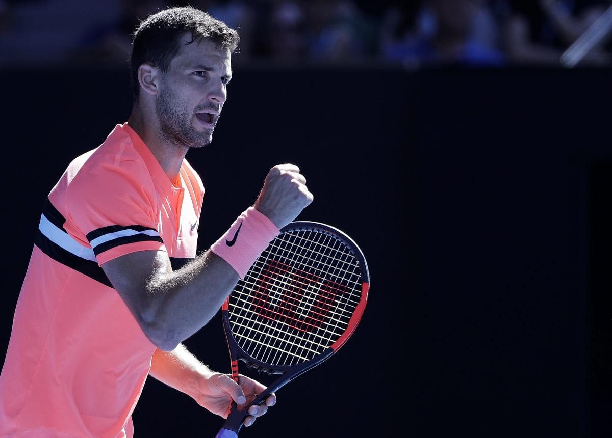 Setback: Bulgaria's Grigor Dimitrov reacts after winning a point against Britain's Kyle Edmund during their quarterfinal tie in Melbourne on Tuesday. AP/PTI