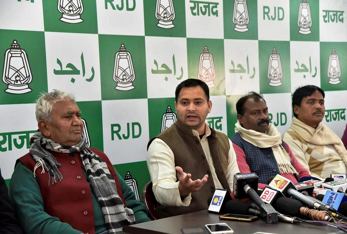 RJD leader Tejashwi Yadav addresses a press conference in Patna on Friday.