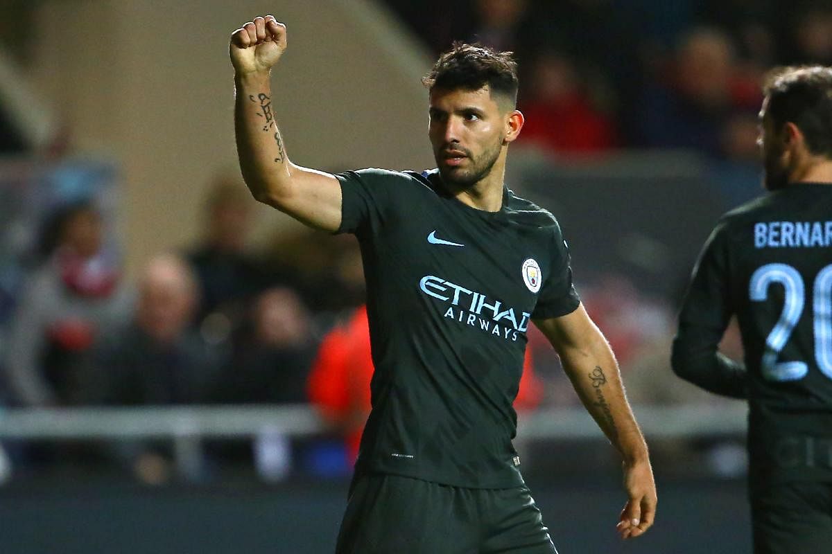 ON TARGET Manchester City's Sergio Aguero celebrates after scoring against Bristol City during their League Cup semifinal on Wednesday night. AFP