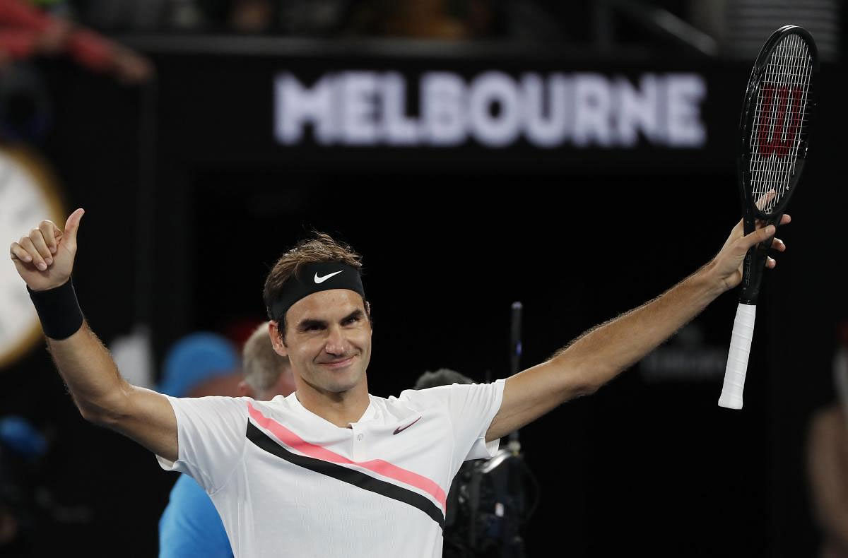 Switzerland's Roger Federer celebrates winning his match against Czech Republic's Tomas Berdych. REUTERS