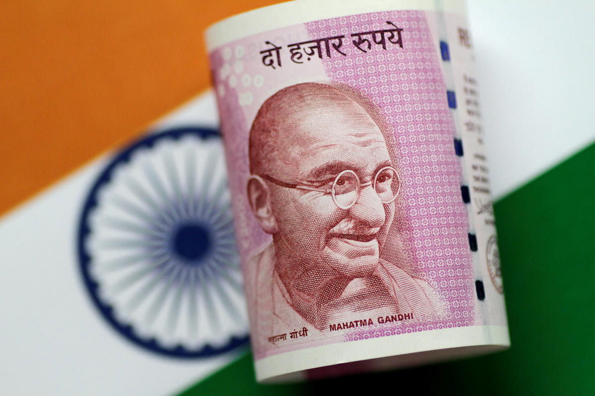FILE PHOTO: An India Rupee note is seen in this illustration photo June 1, 2017. REUTERS/Thomas White/Illustration/File Photo GLOBAL BUSINESS WEEK AHEAD - SEARCH GLOBAL BUSINESS 04 DEC FOR ALL IMAGES
