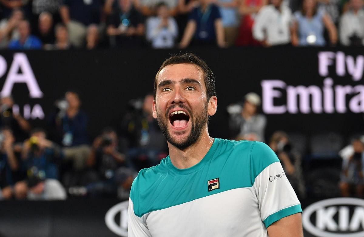 Croatia's Marin Cilic celebrates beating Britain's Kyle Edmund in their men's singles semifinals of the Australian Open on Thursday.