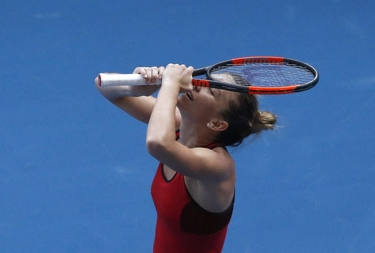 Simona Halep of Romania celebrates her win over Angelique Kerber of Germany in the semifinals of the Australian Open on Thursday. REUTERS