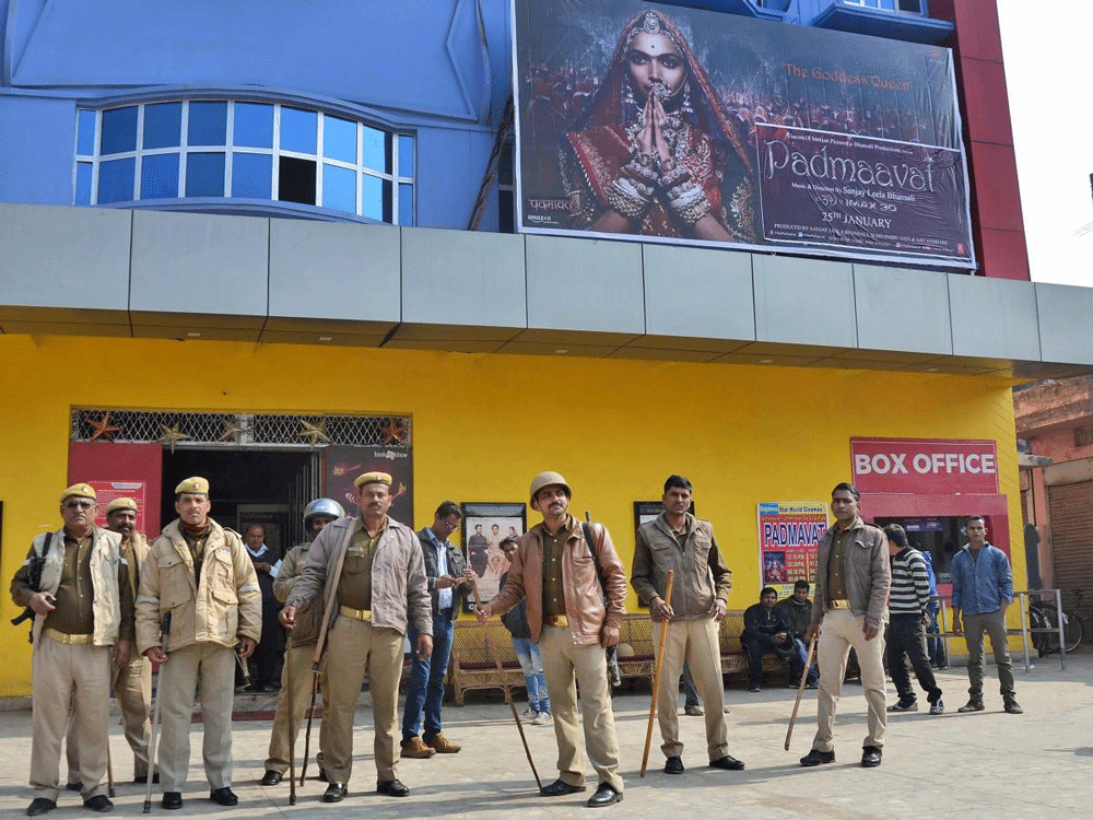 Heavy police force deployed at Novelty Theatre in Lucknow where film Padmaavat was released on Thursday. PTI Photo