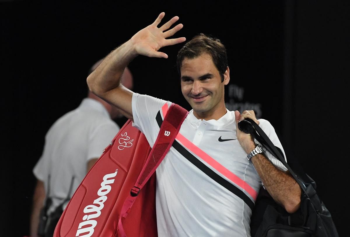 Switzerland's Roger Federer gestures after South Korea's Chung Hyeon retired from their men's singles semifinal on Friday.