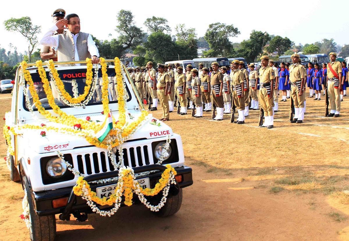 Kodagu District In-charge minister M R Seetharam receives the guard of honour during the Republic Day event in Madikeri on Friday.