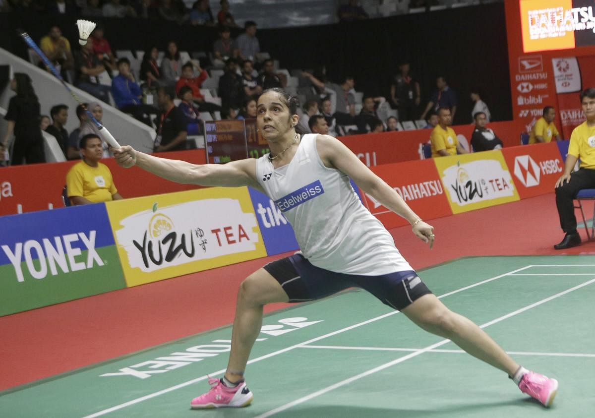 India's Saina Nehwal returns a shot to Pusarla V. Sindhu of India during the quarterfinal round of the women's single match the Indonesia Masters badminton tournament at Istora Stadium in Jakarta, Indonesia, Friday, Jan. 26, 2018.