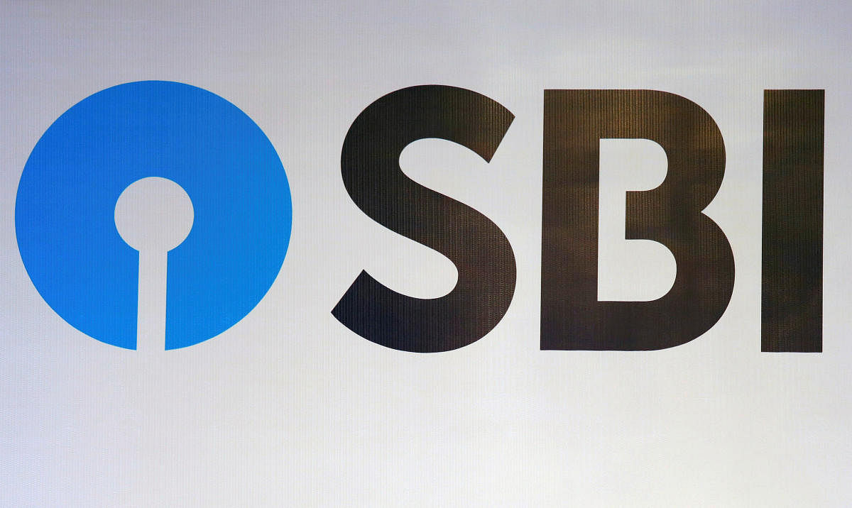 The new logo of State Bank of India (SBI) is pictured at the podium of the venue of a news conference after the announcement of SBI's fourth quarter results, in Kolkata, India May 19, 2017.