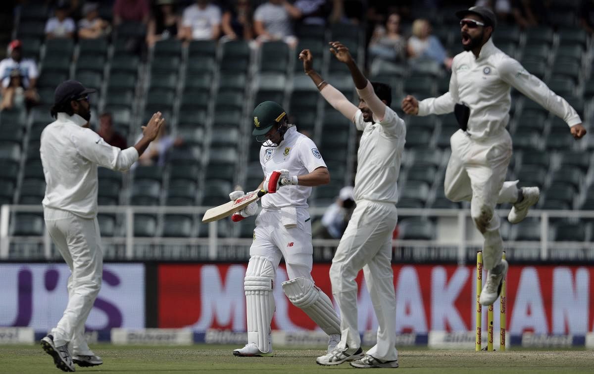 South Africa's batsman AB de Villiers, second from left, leaves the field as India's players celebrate his dismissal on the fourth day of the third cricket test match between South Africa and India at the Wanderers Stadium in Johannesburg, South Africa. AP/PTI Photo