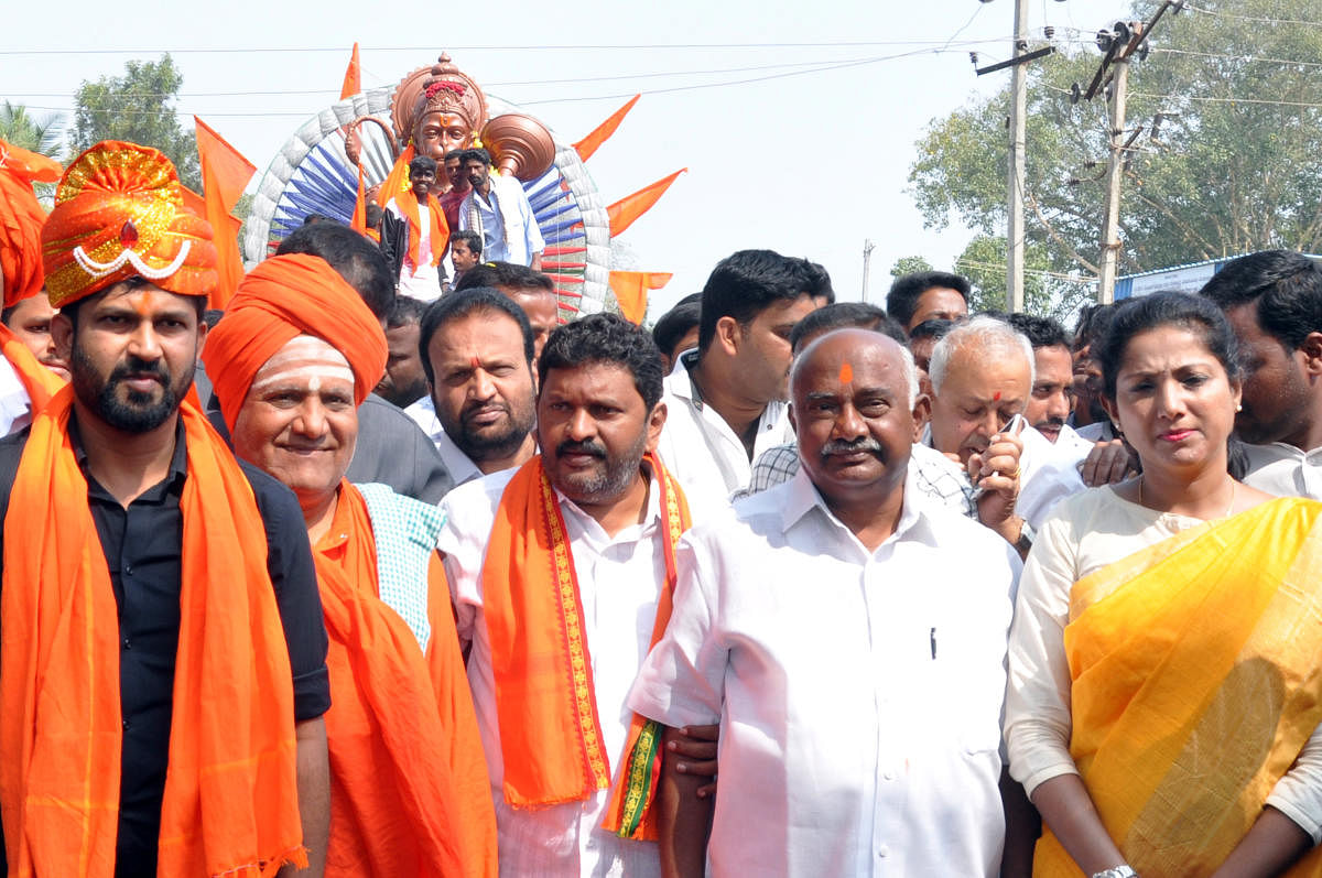 MP Pratap Simha, MLA H P Manjunath, former MP A H Vishwanath and Zilla Panchayat member B Pushpa Amarnath take part in Hanuma Jayanti procession in Hunsur on Saturday.