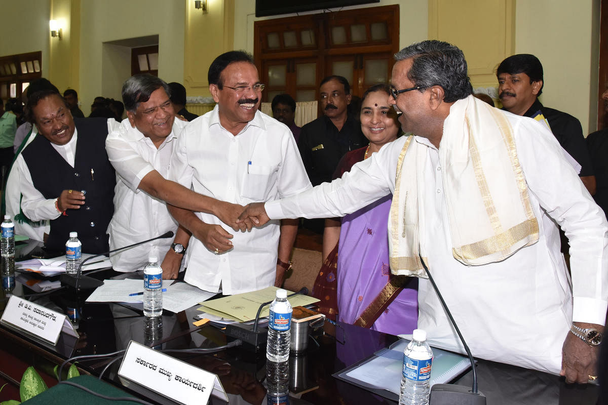 Chief Minister Siddaramaiah greets Leader of the Opposition in the Legislative Assembly Jagadish Shettar at the all-party meeting on Mahadayi river water sharing dispute in Bengaluru on Saturday. Leader of the Opposition in the Legislative Council K S Eshwarappa, Union minister D V Sadananda Gowda and Chief Secretary Rathna Prabha look on. DH Photo.