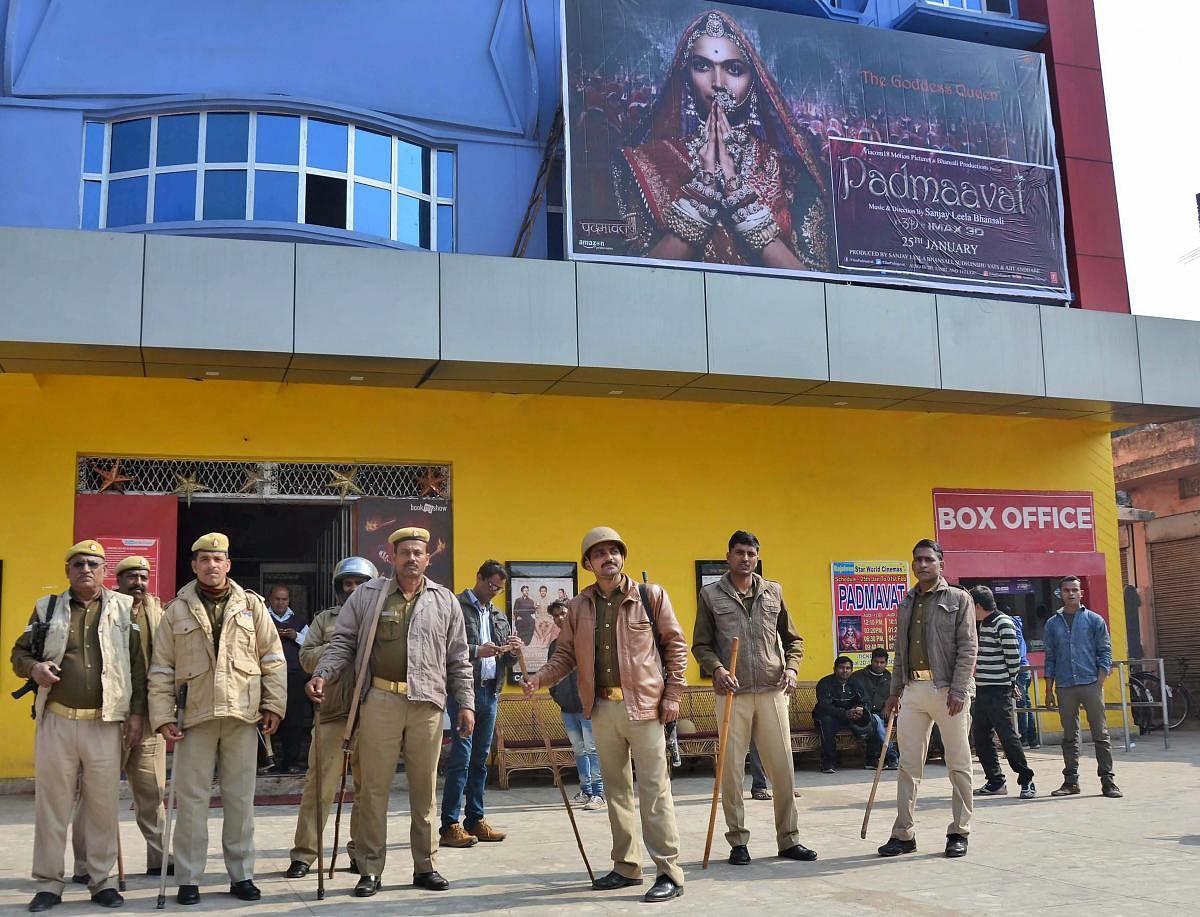 Police personnel stand guard outside a cinema hall after the film 'Padmaavat' was released, in Mirzapur, Uttar Pradesh. PTI