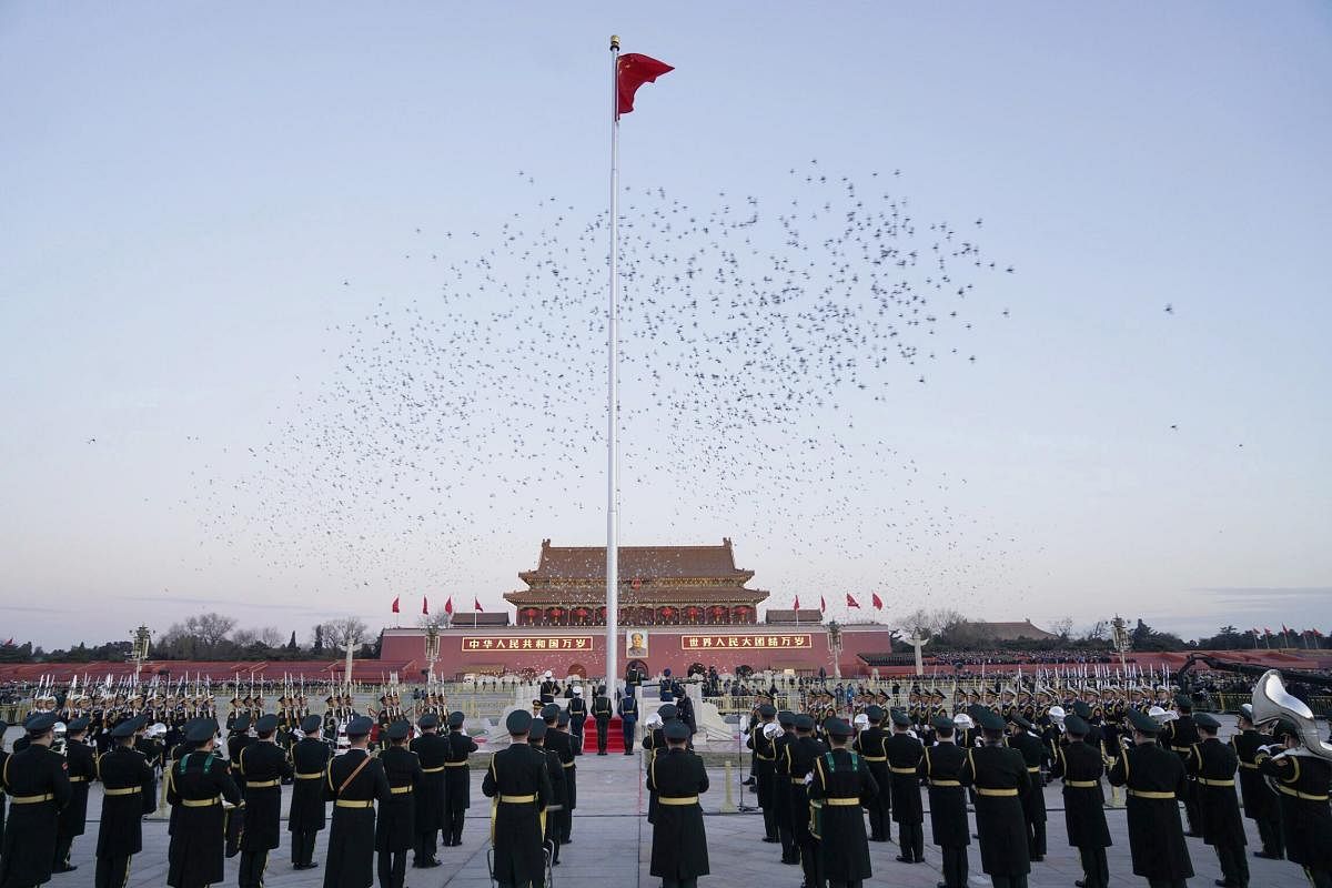 The Guard of Honor of the Chinese People's Liberation Army perform the national flag-raising duty on Tian'anmen Square in Beijing, China. AP/PTI