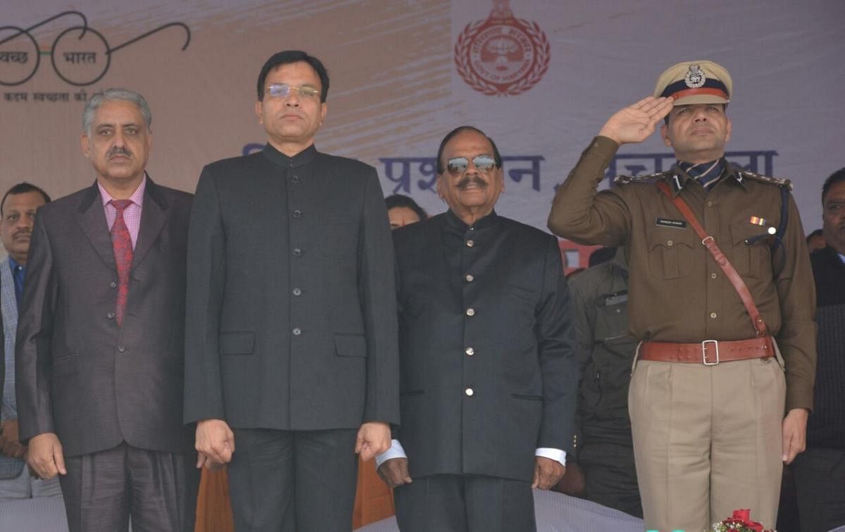 Convicted former Haryana DGP SPS Rathore (second from right) on stage at the republic day function in Panchkula.
